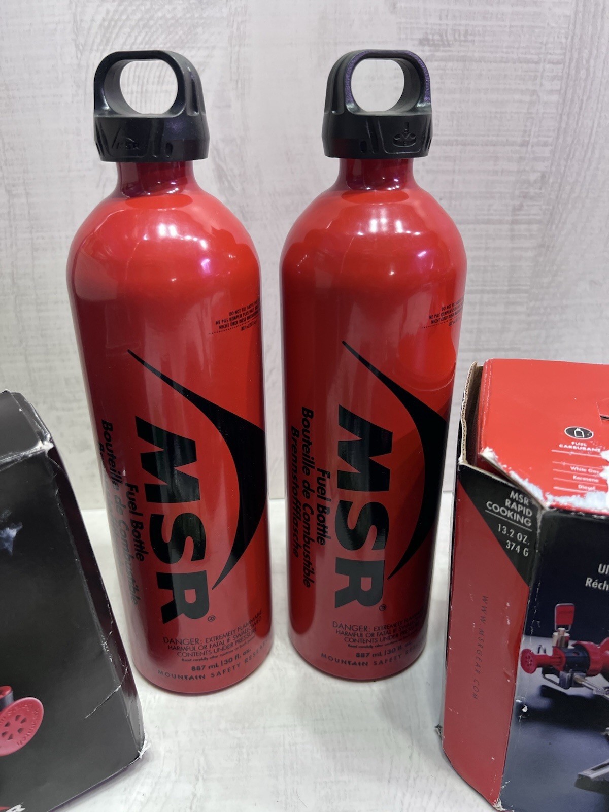 XGK EX MSR MULTI FUEL STOVE TWO STANDARD FUEL PUMPS TWO 30 OZ FUEL BOTTLES CAMP