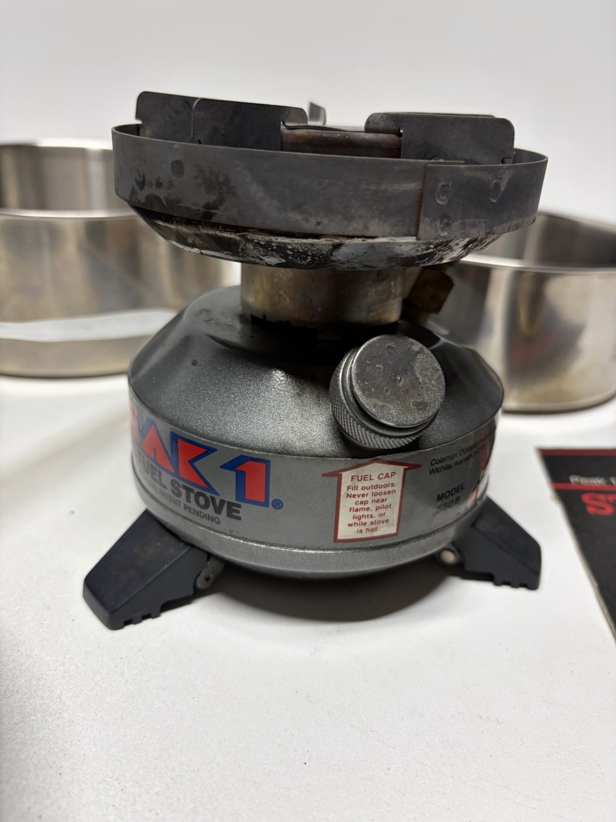 Vintage Coleman 550B499 Peak 1 Multi Fuel Lightweight Backpack Stove w/ Case Box