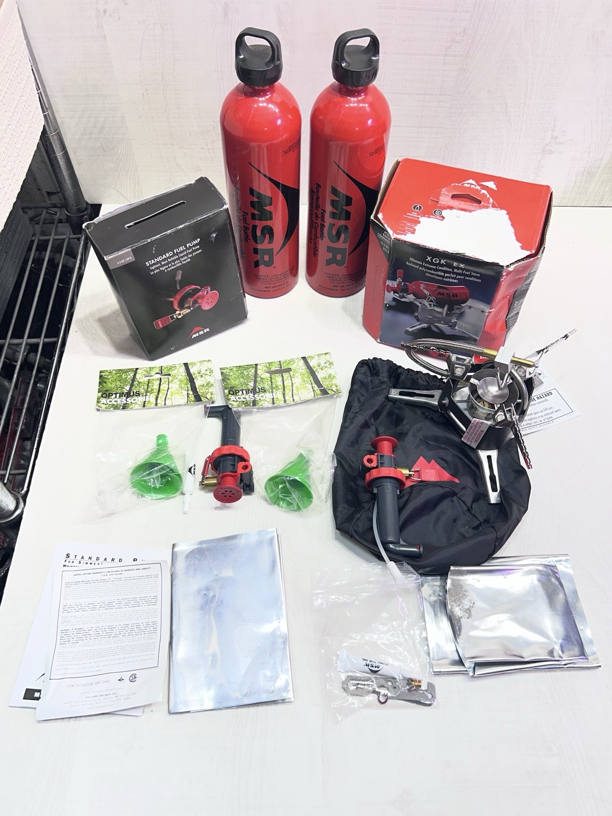 XGK EX MSR MULTI FUEL STOVE TWO STANDARD FUEL PUMPS TWO 30 OZ FUEL BOTTLES CAMP